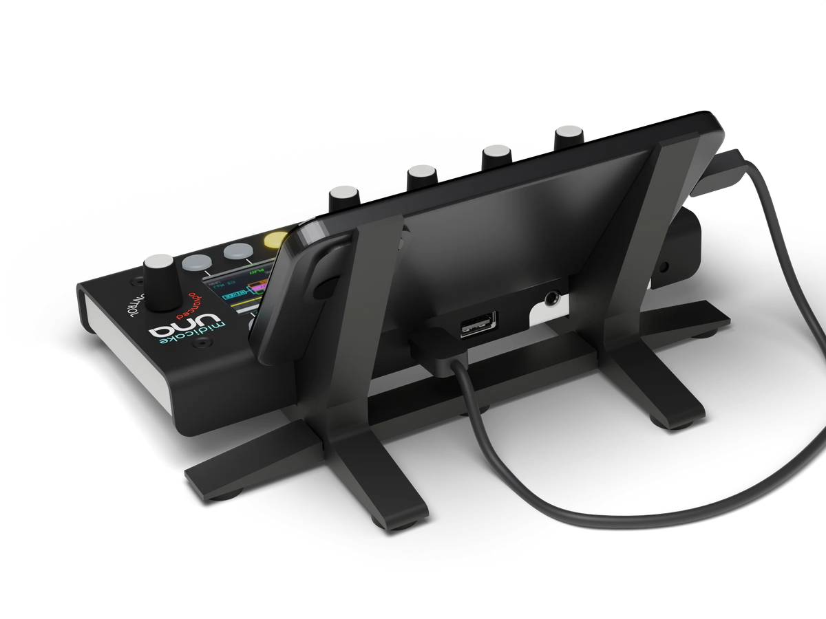 Rear view of Midicake UNA on the Angle Stand, showing the phone support and cable routing to UNA's back-panel ports