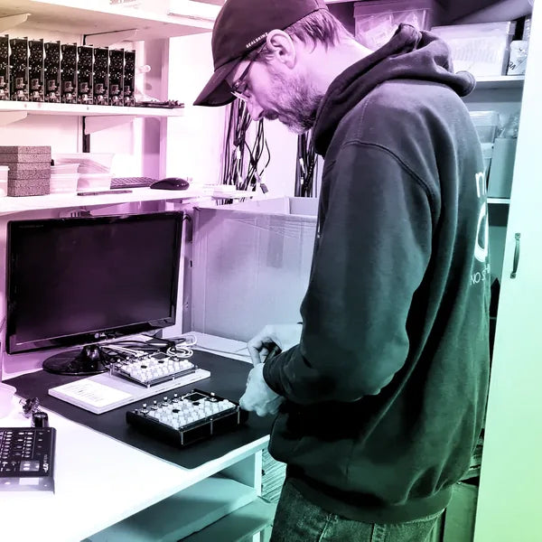 Chris at the Midicake workshop bench, testing units